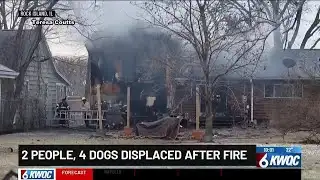 2 people, 4 dogs displaced after fire