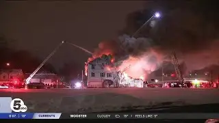 Akron firefighters battle blaze at condemned apartment complex