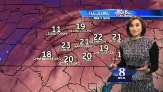 AM flurries ending, blustery and cold Friday