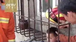 Another child rescued! Firefighters free boy from bars