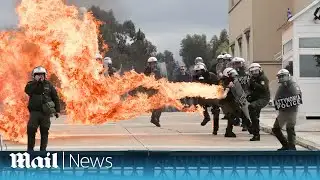 Athens: Police targeted with petrol bombs in protest over rail crash