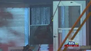 Attic fire burns through roof