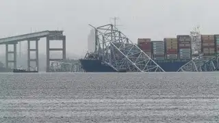 Baltimore bridge collapse: Video shows rescuers pull man to safety after surviving