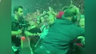 Billie Eilish aggressively pulled by fan in barricade during Miami concert, video shows