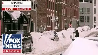Boston residents work hard to clear cars after massive snow fall