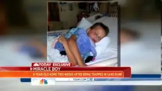 Boy who was buried in sand dune is back home