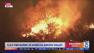 Brush fire ignites in Jurupa Valley, threatening structures