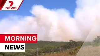 Bushfire emergency and fugitive manhunt intensify | 7NEWS