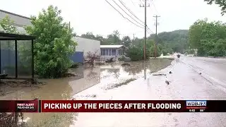 Business Cleaning Up Mess Left by Flash Flooding