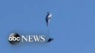 Caught on camera: paraglider narrowly escapes disaster