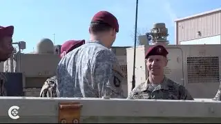 Chaplain marches with troops and inspires