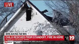 Child rescued from Akron standoff, fire in home