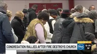 Church members gather for worship after fire destroys building