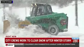 City crews work to clear snow after winter storm
