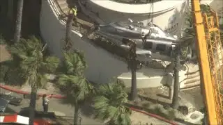 Clean-up crews in California remove wreckage from helicopter crash