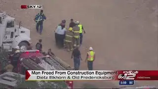 Construction worker rescued after being trapped in grader accident