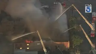 Crews battle large commerical building fire in Commerce