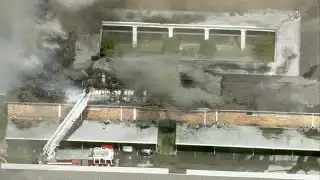 Crews battling large apartment fire