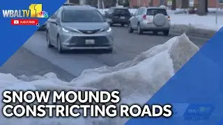 Crews clear mounds of snow, ice constricting roads