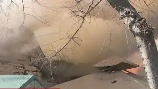 Crews investigate a house fire after a explosion in Sacramento