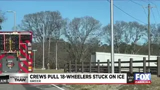 Crews pull 18-wheelers stuck on ice in Greer