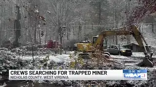 Crews searching for trapped miner