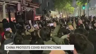 Crowd angered by lockdowns calls for China