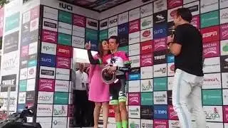 Cyclist Refuses To Leave Podium Until Kissed By Model