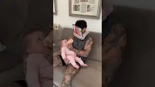 Dad outsmarts baby while feeding