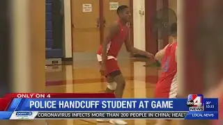 Deputy handcuffs student at game