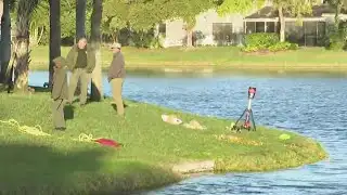 Divers with Broward Sheriff’s Office continue searching Deerfield Beach lake