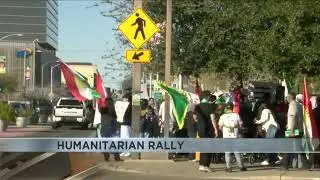 Dozens gather for a Kurdish humanitarian rally.
