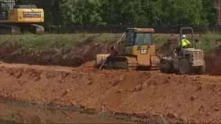 Drained  canal allows work on bank as well as bridge