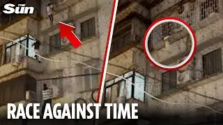 Dramatic moment heroes scale multi-storey building  to CATCH TODDLER hanging from window