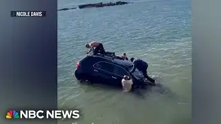 Dramatic rescue after woman drives car into frigid water