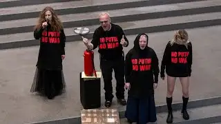 Drastic protest: Pussy Riot member urinates on Putin picture