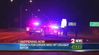 Driver flees after crashing into police cruiser