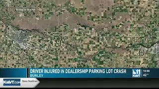 Driver injured after pickup crashes into Burley dealership parking lot