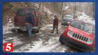 Driver rescued after night trapped on icy hill