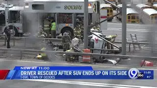 Driver rescued after SUV ends up on its side