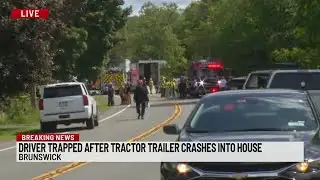 Driver trapped after tractor trailer crash in Brunswick