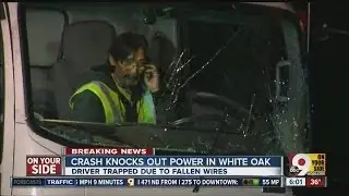 Driver trapped in car after crash