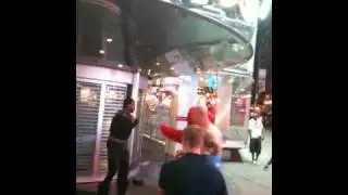 Elmo breaks up Batman fight in Time Square!