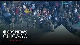 Federal agents, crowd stand off in Chicago, arrests made