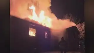 Fire crews battle flames in freezing conditions