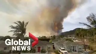 Firefighters battle fast-moving wildfire on California