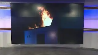 Firefighters battle fire at car dealership