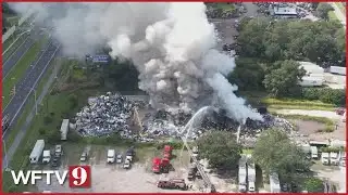 Firefighters battle HUGE fire at Florida scrapyard