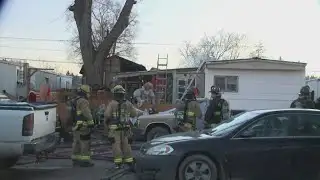 Firefighters battle mobile home fire in Spokane Valley