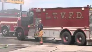 Firefighters battle semi-trucks